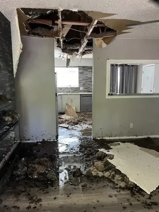 A dehumidifier running during a dry-out in a Lewisville Lake area home