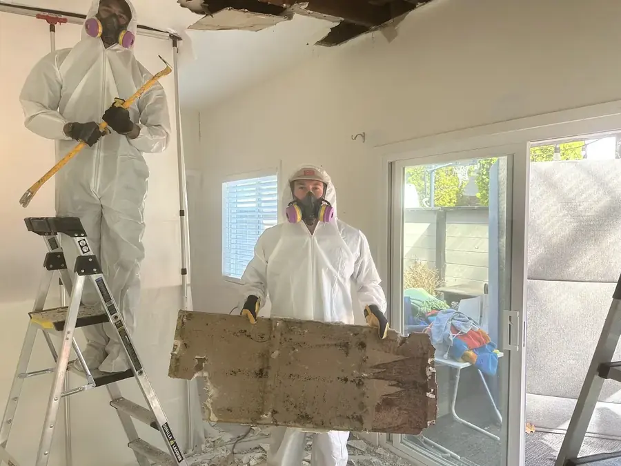 Air movers and a dehumidifier drying a water damaged Lake Dallas home