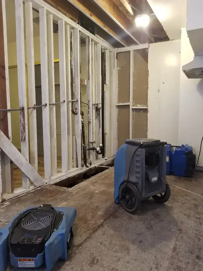 Drying equipment after a burst pipe in a Lake Dallas home