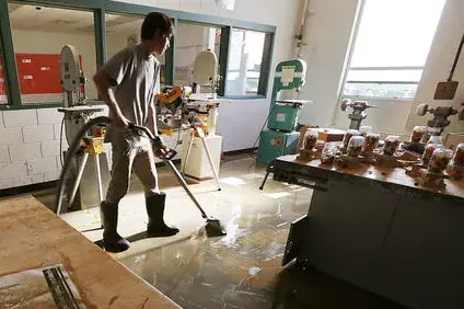 Technician extracting standing water in a Lake Dallas home